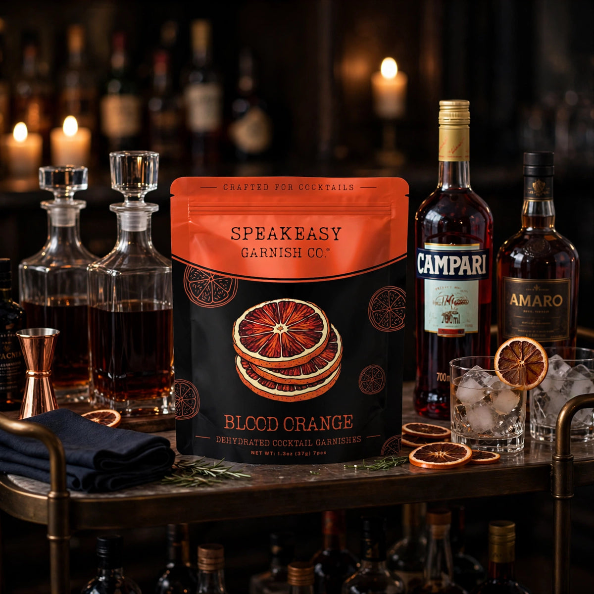 Speakeasy Garnishes blood orange pouch on a home bar cart among bottles and glassware